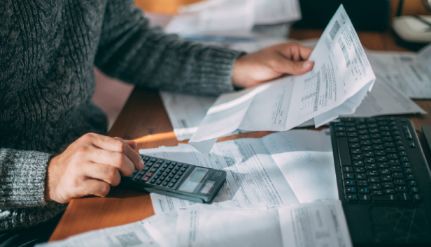 A man using a calculator
