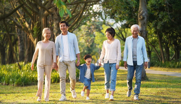 Grandparents walking with their children and grandchild