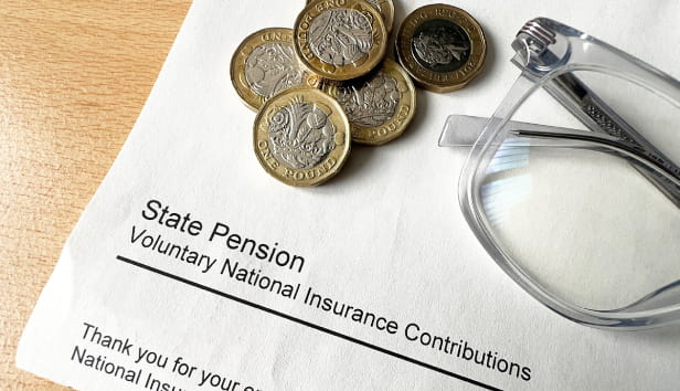 A letter with the words 'State Pension | Voluntary National Insurance Contributions' printed on it