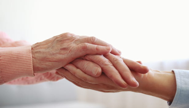 Two people holding hands