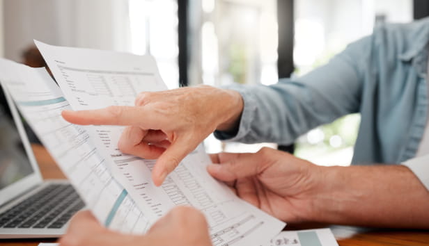 Two people looking at some paperwork