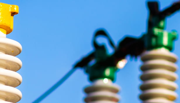 Panoramic view Electric power transmission lines in the evening. High voltage switchgear and equipment of power plant.