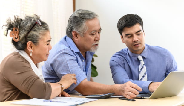 Asian senior couple feeling happy and pleasant after received advice about family financial planning from professional financial planner staff at home.