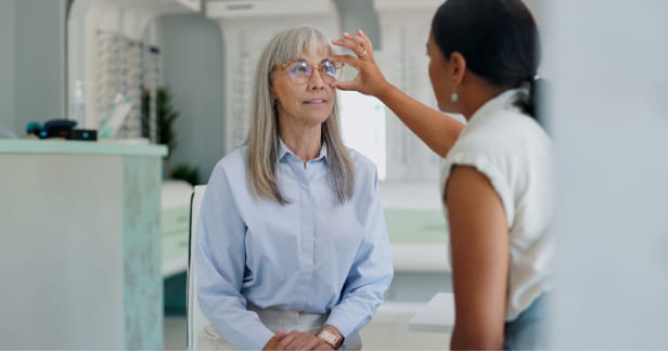 Mature woman, optometrist and glasses retail for shopping consultation for frame size, assessment or prescription. Female person, eye care and sight store with optician advice, spectacles or lens.