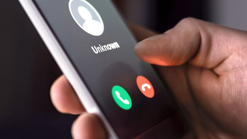 A person receiving a call from an unknown number
