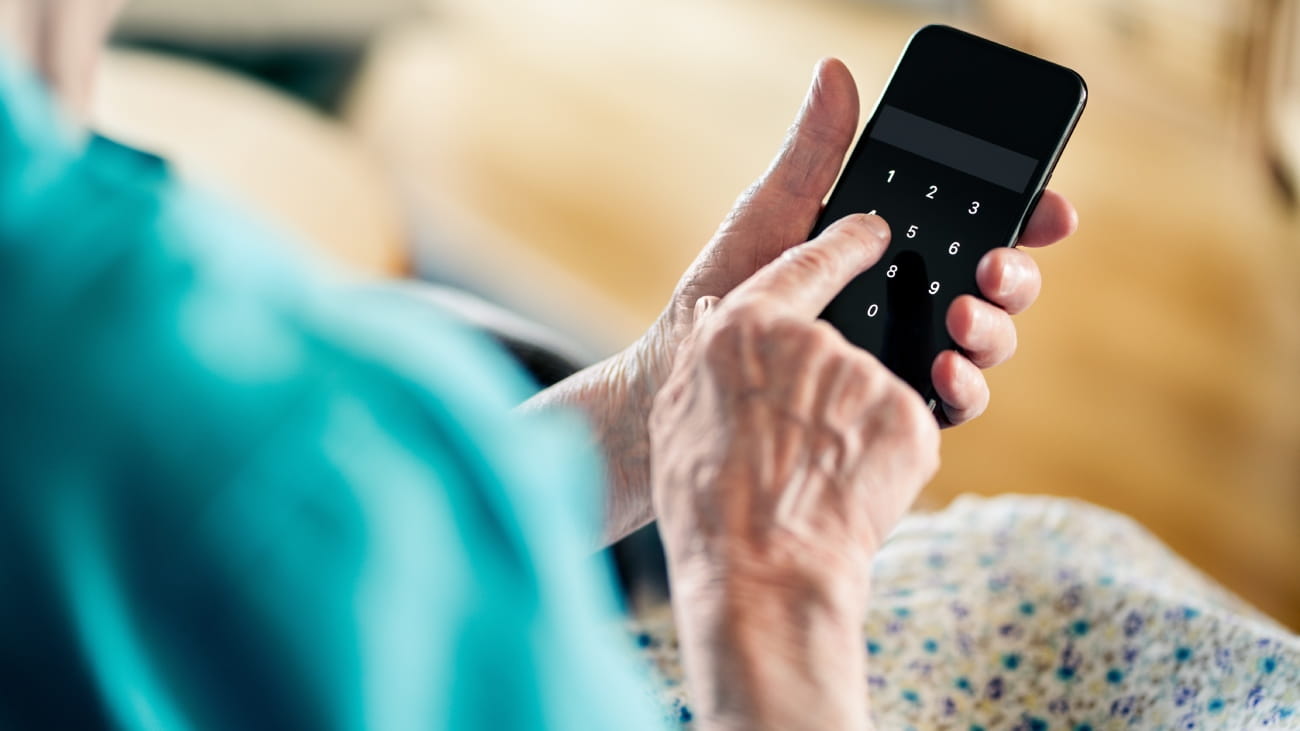 Someone pressing a calculator