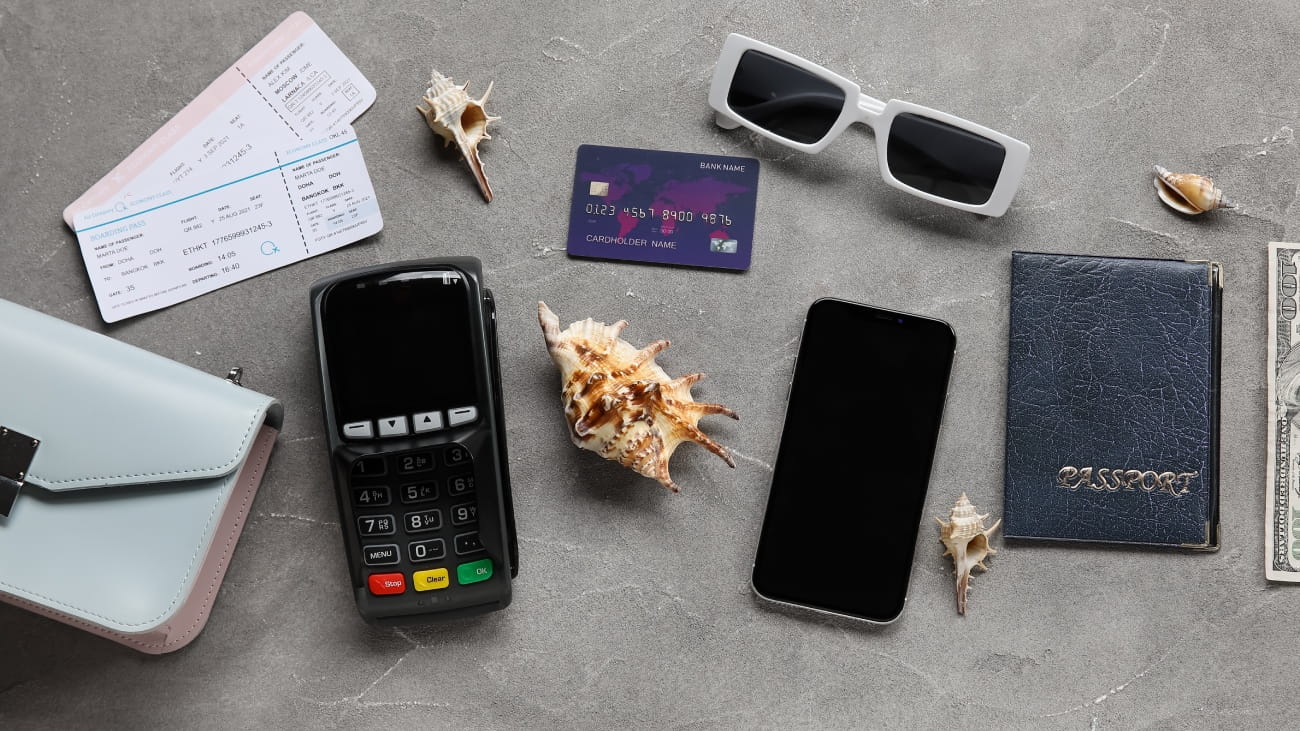 Composition with payment terminal, credit card, mobile phone and tickets on grunge background