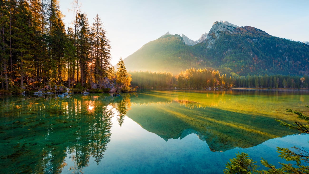 Wonderful autumn sunrise of Hintersee lake. Amazing morning view of Bavarian Alps on the Austrian border, Germany, Europe. Beauty of nature concept background.