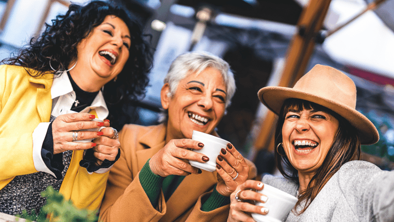 Group of mature women having  fun at the café bar enjoying breakfast drinking coffee- Three senior female  taking selfie with smart phone outdoors at cafeteria dehor-Life style concept
