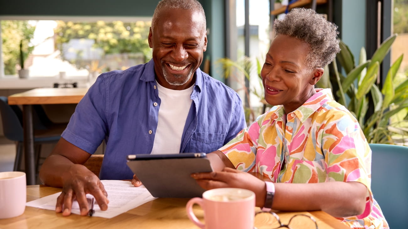 Finance, planning and couple consulting financial advisor for help, guidance or loan in office. Investment, deal and agreement by black woman and man with consultant for budget or insurance plan.