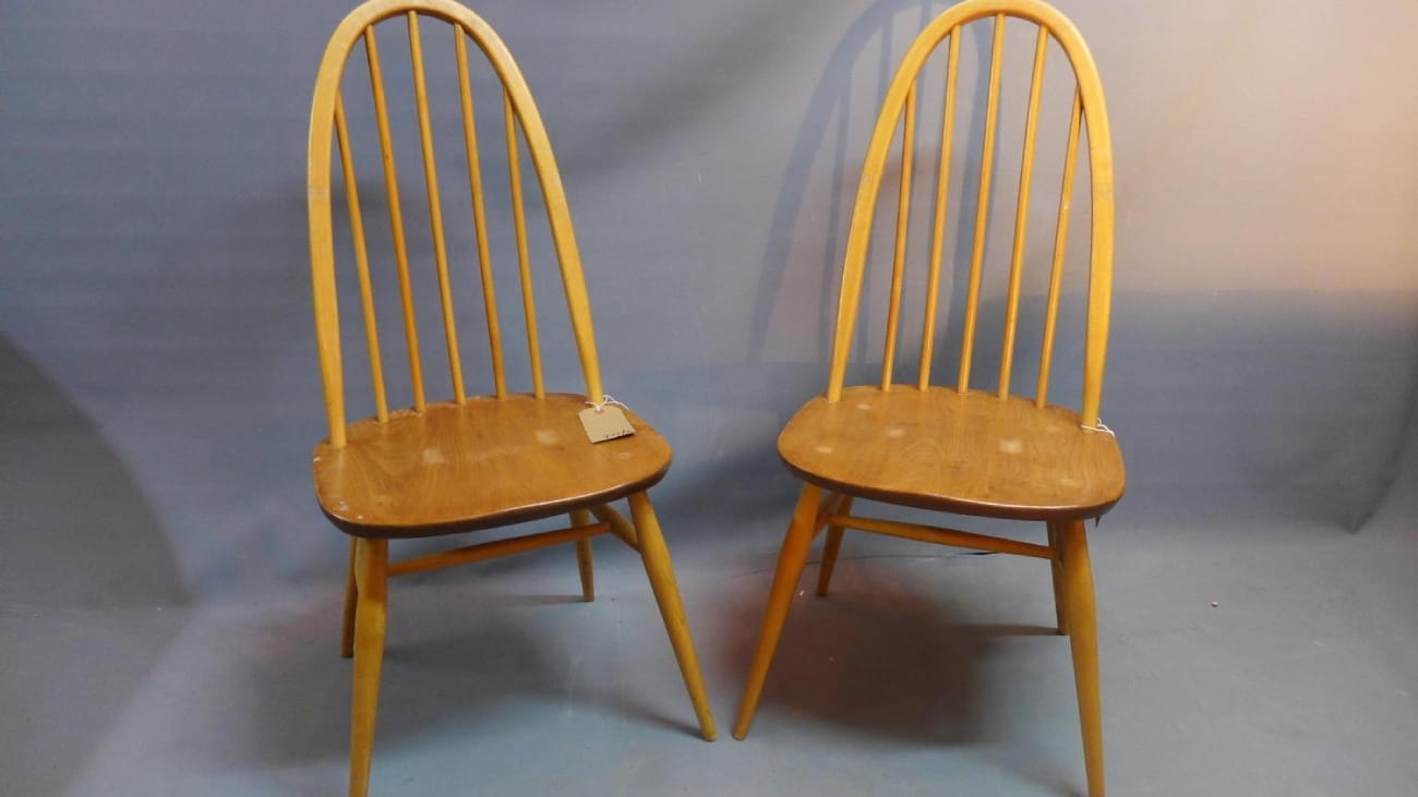 Two ercol wooden chairs.