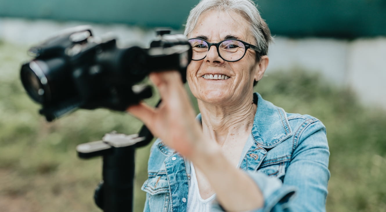 Joyful woman opening a live stream on social app greeting her followers and asking questions.
