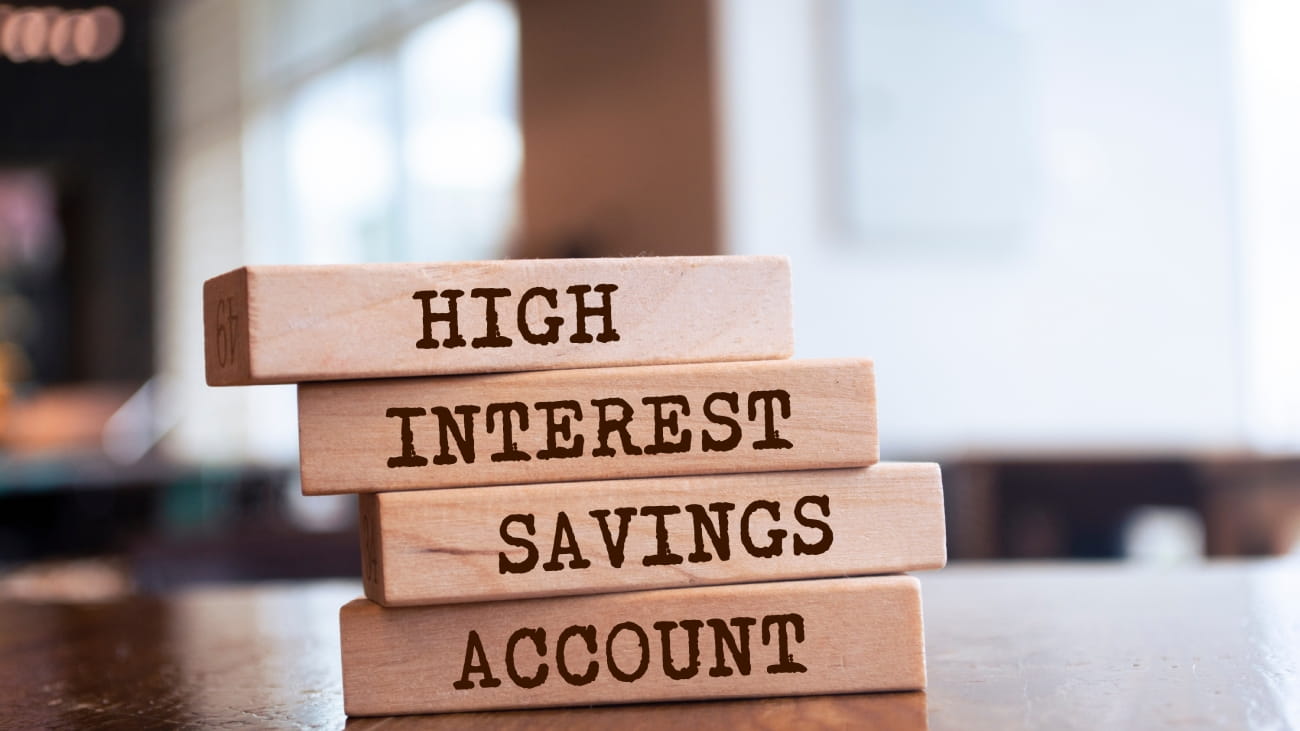 Wooden blocks with words 'High Interest Savings Account'.