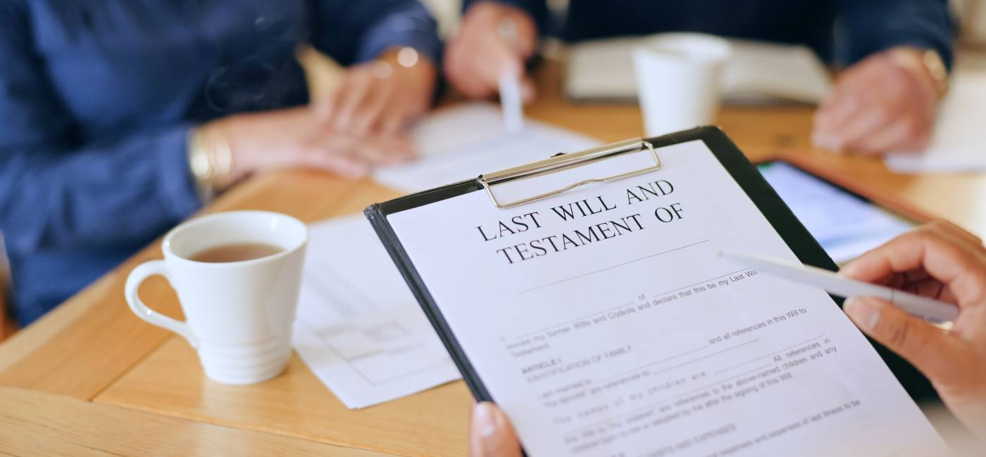 Clip folder of a last will and testament being signed
