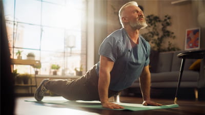A man doing yoga indoors