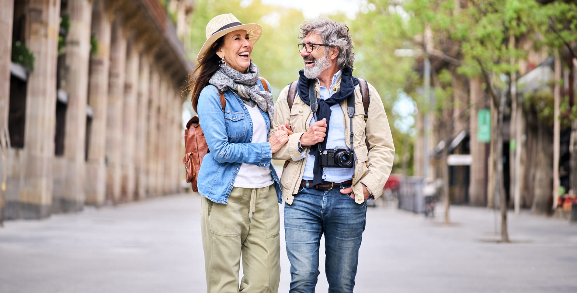 A happy couple out walking in a city