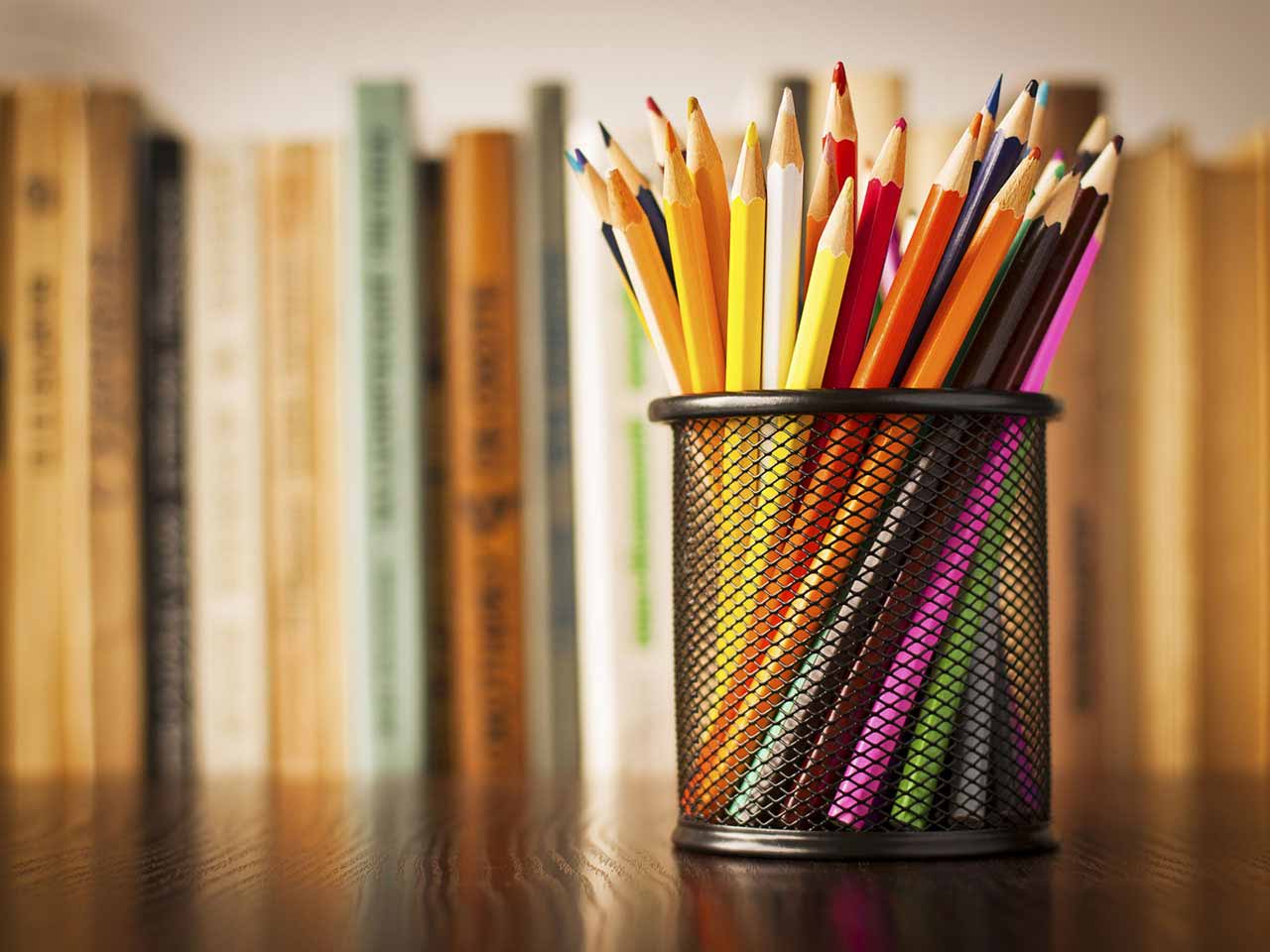 Pencil pot tidy and books on desk