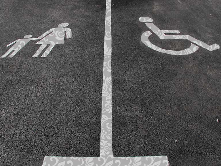 A parent and child car parking space next to a disable car parking space